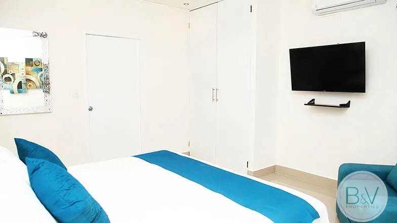 villa-minerva-1-cozumel-for-rent-bedroom-tv-closet